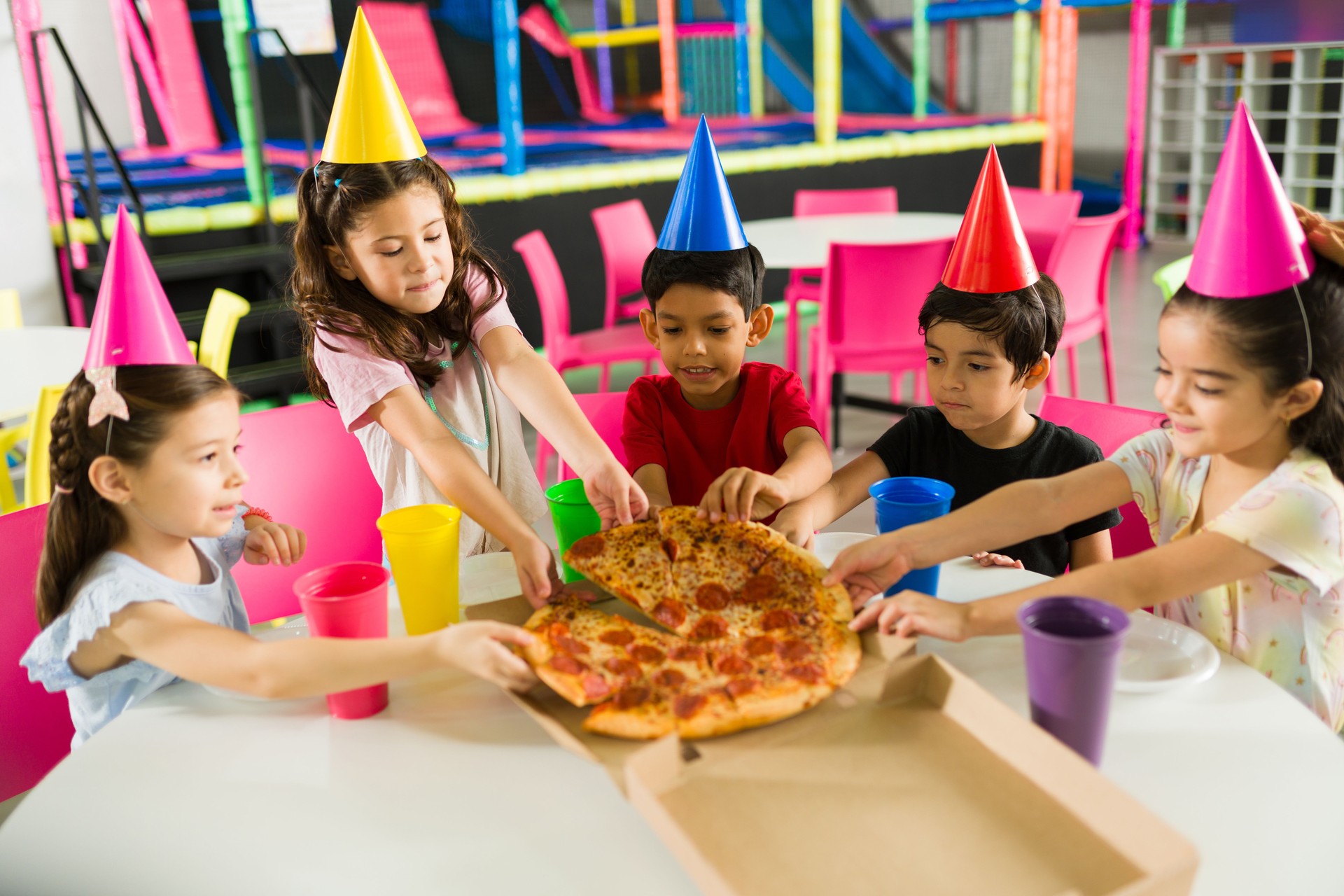 Excited group of kids at the playground during a birthday party